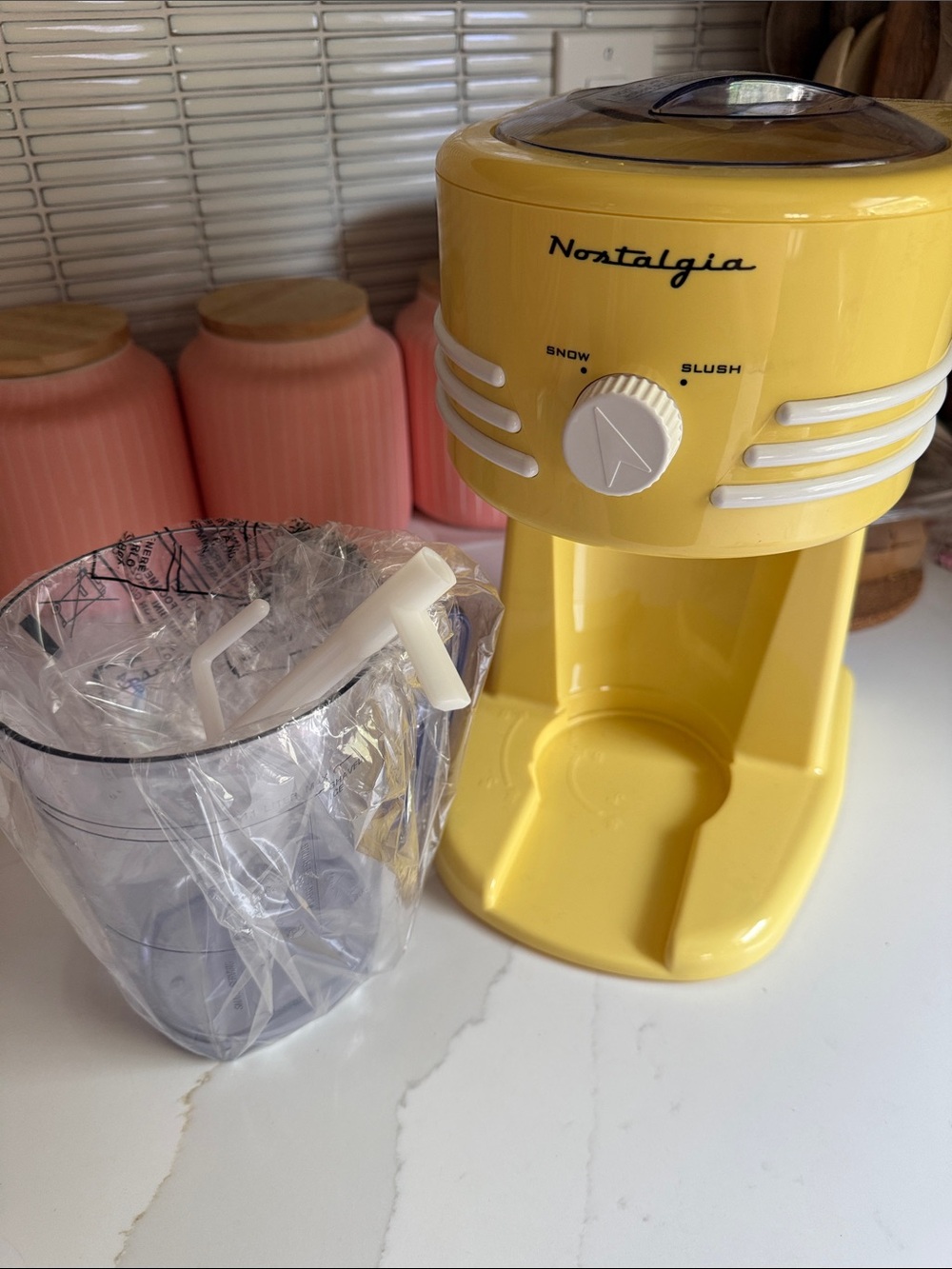 Nostalgia Yellow Snow Cone & Slush Machine with Clear Mixing Cup
